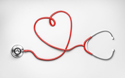 A red stethoscope forms the shape of a heart.