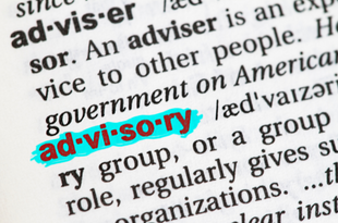 A close up of a page in a dictionary with the word, "advisory" highlighted in blue.