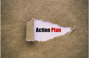 The words "action," in black, and "plan," in red, are revealed through a ripped piece of brown Kraft paper.