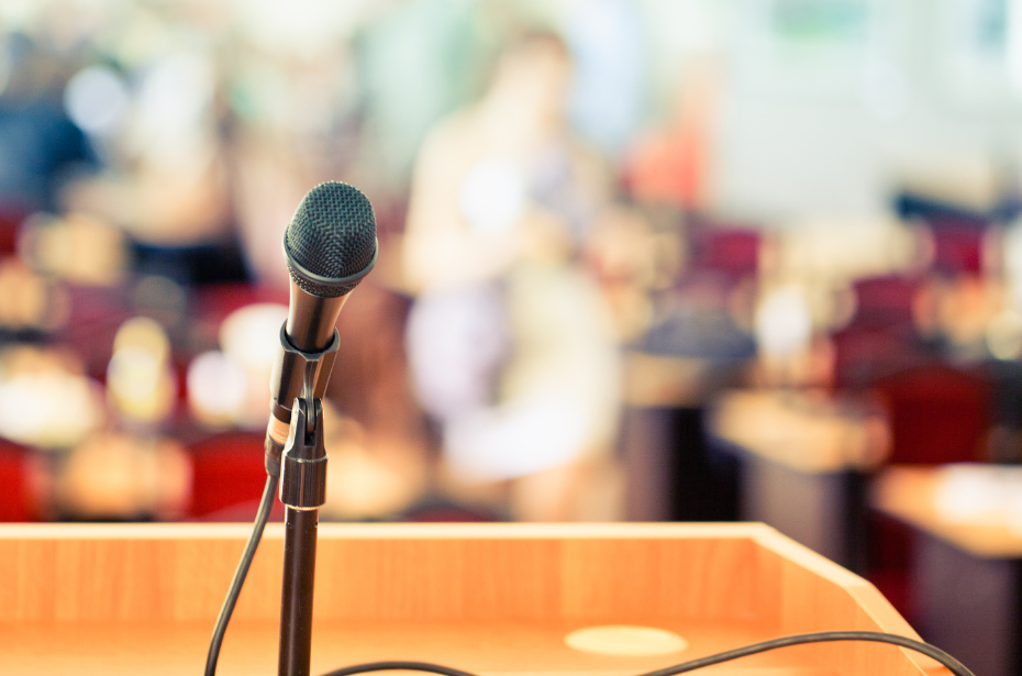 A photo of a microphone at a podium. 