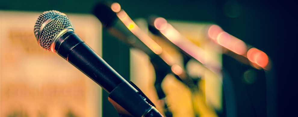 A row of microphones on stands.