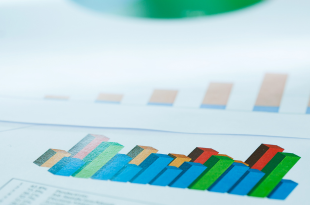 A collage of various types of graphs in blue, red, green, and yellow.