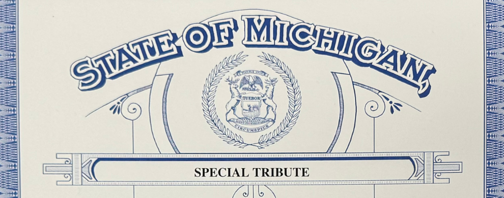 A cream certificate with "State of Michigan" and the Michigan state seal in blue, and "Special Tribute" in black.