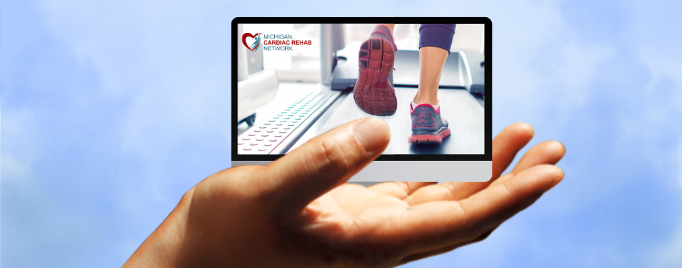 A computer monitor with an image of feet running on a treadmill and the MiCR logo hover above an outstretched palm all over a blue and white mottled background.